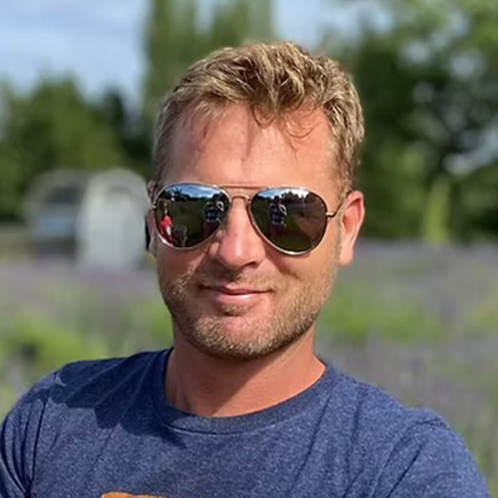 David Loewen, owner of Loewen Greenhouses & Landscaping, standing proudly in his element