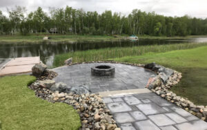 A beautifully designed paver pathway leading to a stunning fire pit in Kittitas County.