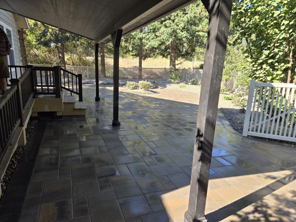 Loewen Greenhouses & Landscaping features a patio with pavers, highlighting outdoor design options for driveways.